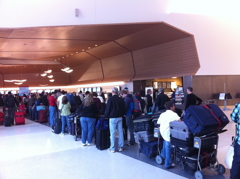 Passengers waiting at an airport gate